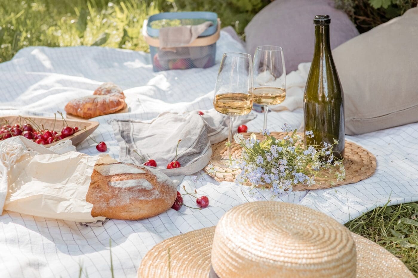 Summer picnic with rustic servers, wine and bread. Aesthetic picnic