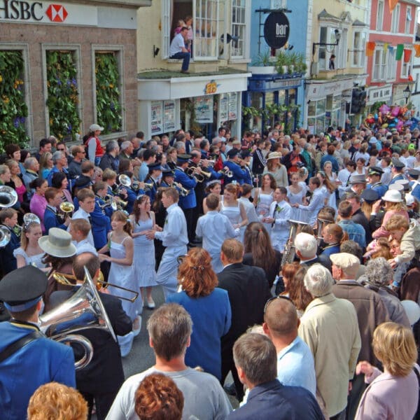 The children's dance going up Coinagehall Street to the Guildhall on flora day, Helston, Cornwall