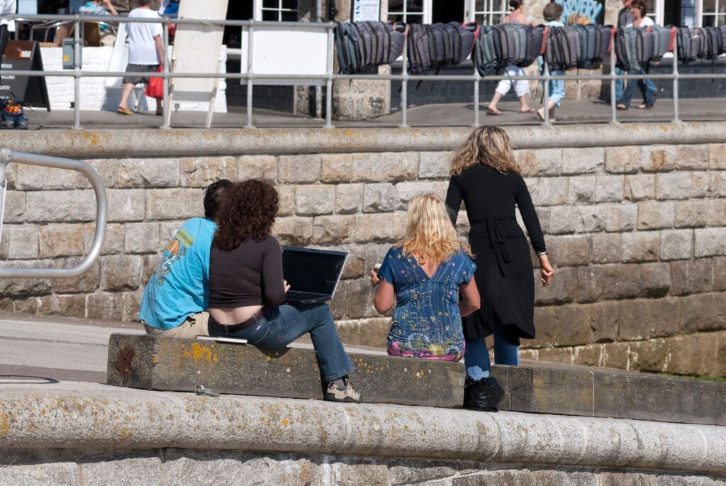 Remote working on laptop, St Ives harbour, Cornwall