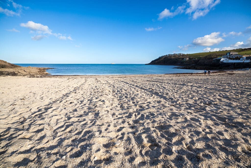 Sun and sand on a summer’s day at Swanpool Beach, Falmouth, Cornwall