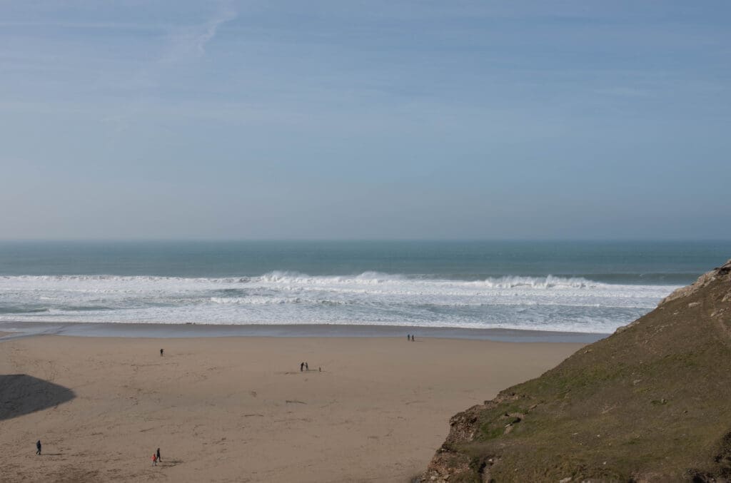 Tourists enjoy the sun, sea and sand at Chapel Porth, Cornwall