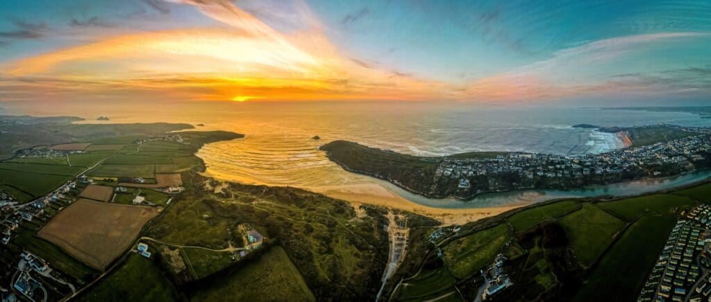 Sunset over the caravan park at Crantock Beach in Cornwall, UK.