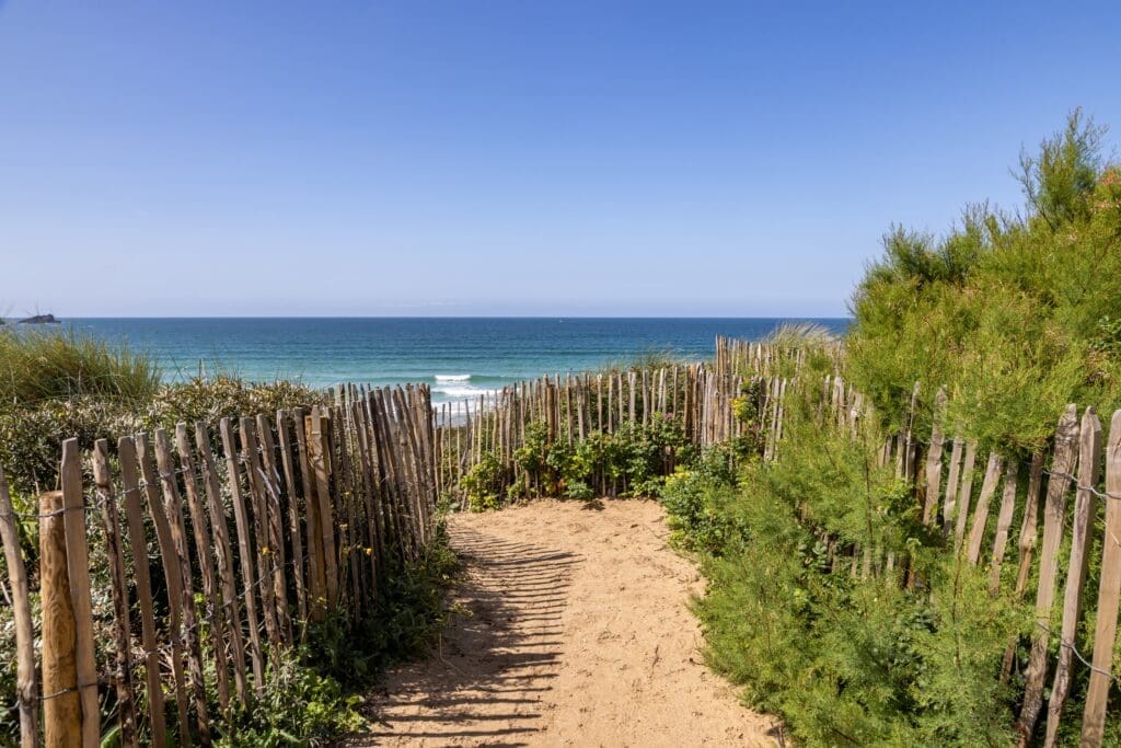 A wooden fence leading to Fistral Beach, Cornwall
