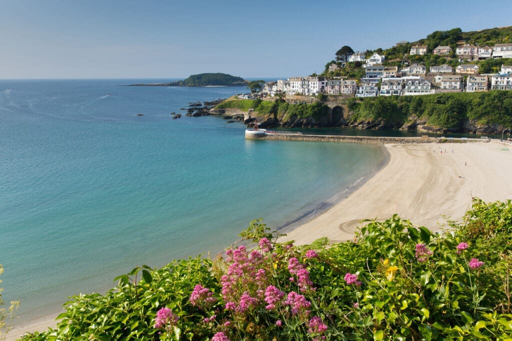 A view across East Looe Beach on a calm summer’s day